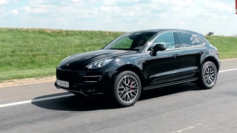 MINSK, BELARUS - AUGUST 5, 2016: Porsche Macan Turbo at the test-drive. Extreme driving on a curve. 3 shots of car SUV skidding 