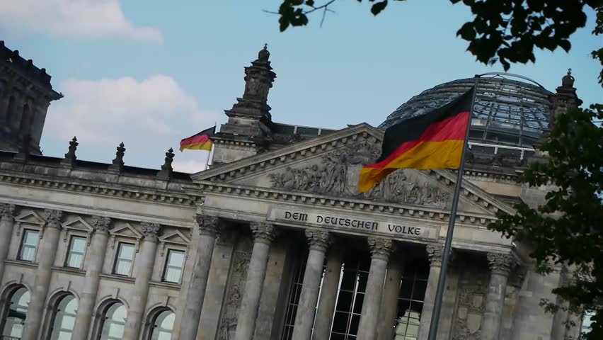Reichstag - German Parliament in Berlin with waving flags Royalty-Free Stock Footage #1871266