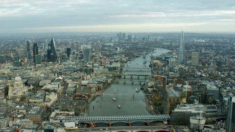 Aerial view of the River Thames by famous buildings London UK