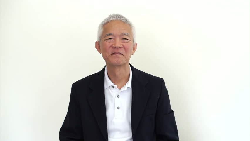 Old Asian senior elder businessman holding white sign. CEO business owner happy showing board