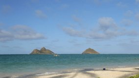 Lanikai Beach, Oahu, Hawaii, with the Mokuluas in the background (2 short clips combined).