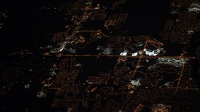 Night video clip of suburbs taken from a plane on approach.