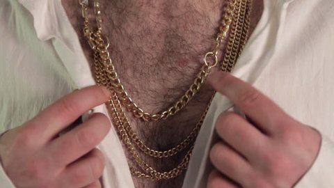 Hairy Disco Chest - Slow Motion
A disco aficionado pops his collar and shows off those gold chains for a manly night avec dance!