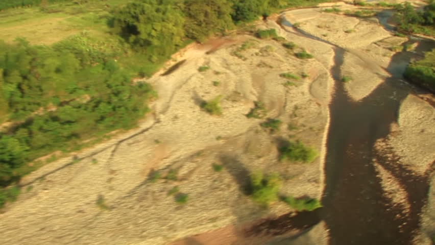 HD: Helicopter shot over dry river bed