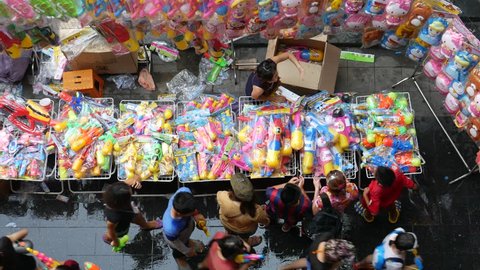 Bangkok, Thailand-April 14, 2016: selling water guns. Locals and tourists celebrate Songkran Festival, Traditional Thai New Year. People play water, and some use water guns to enjoy the festival.