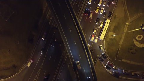 Complex road junction from above. Unique night aerial drone flight. Center of Europe modern Moscow. Evening road traffic, cars moving. High altitude footage. Best 4K video.