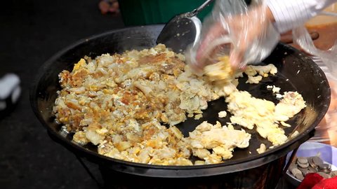 Scrambled eggs on sale on the streets of Bangkok, Thailand