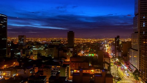 Day to night time lapse in Bogota, Colombia with the camera slowly zooming in