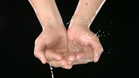 Water pours into hands