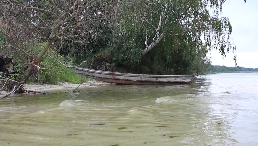 Wooden boat on the lake