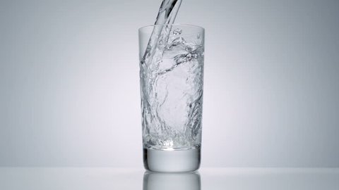 Slo-motion water poured in a glass