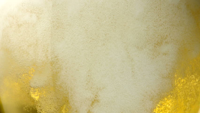 Extreme close-up beer bubbles in a glass Royalty-Free Stock Footage #1878340