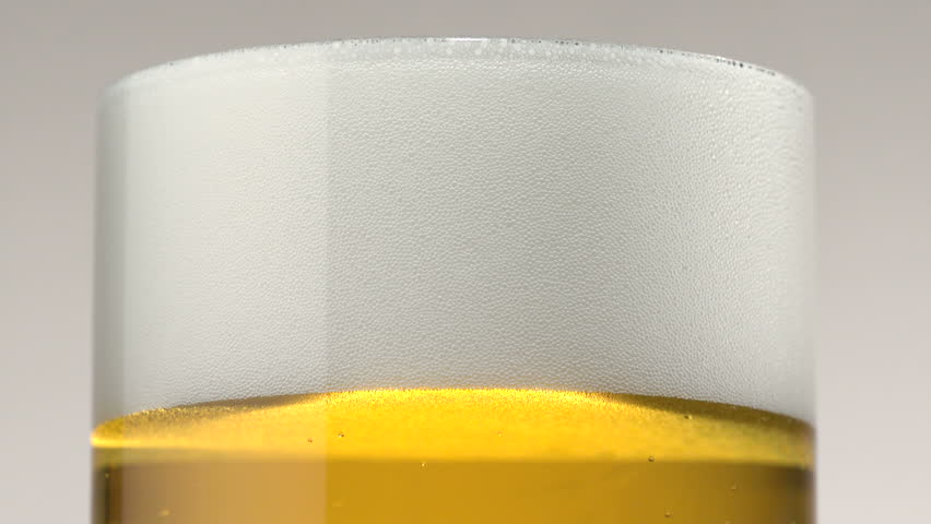 Extreme close-up beer foam and bubbles Royalty-Free Stock Footage #1878421