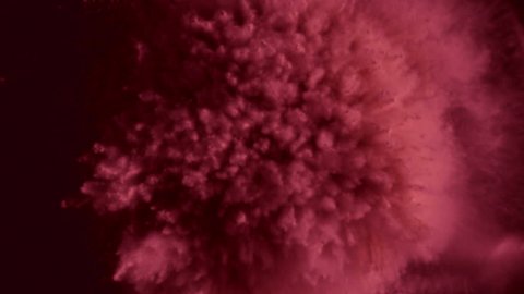 Pink particles fly after being exploded