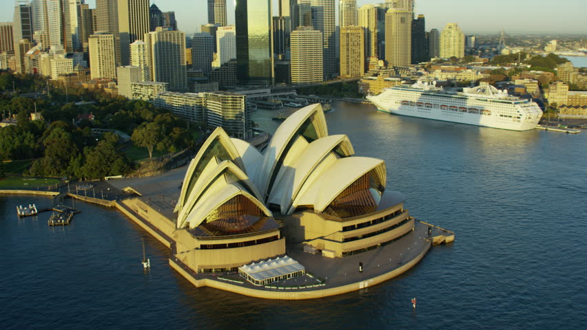 Sydney Australia - 2016: Aerial Opera House sunrise Ferry Harbor Harbour Skyscrapers Cruise Ship Circular Quay Cityscape Building Exterior travel tourism vacation RED DRAGON
