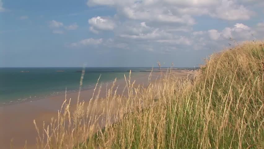 Zoom to remnants of a Phoenix Block in the English Channel from Gold Beach where the Normandy landings took place on D-Day June 6th 1944 in Calvados Department Normandy, France,