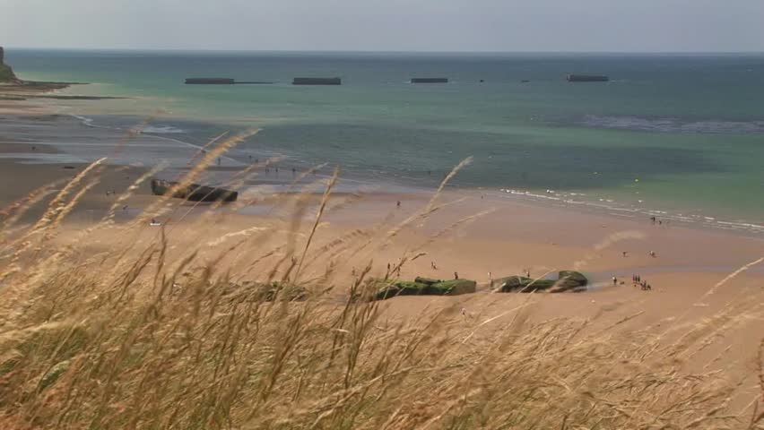 Gold Beach Arromanches where the Normandy landings took place on D-Day June 6th 1944 with remnants of the Mulberry Harbour and line up of Phoenix Blocks i in Calvados Department Normandy, France