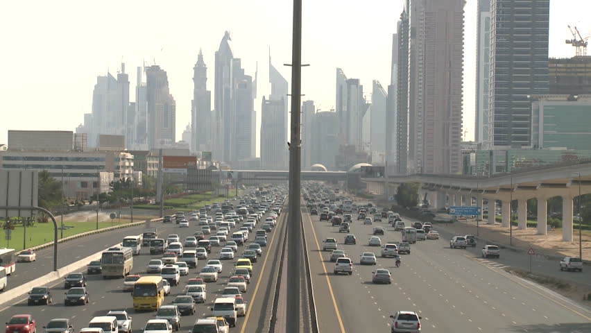 Time lapse, Sheikh Zayed Road, Dubai. Fast moving traffic on Sheikh Zayed Road part of E11 the longest road in the uae. Dubai skyline in background. (Dubai, UAE-2013)