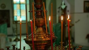 dark candles in the russian church orthodox of service sacrament slow motion video