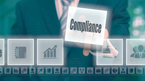 Businessman pressing an Compliance concept button on a blue background