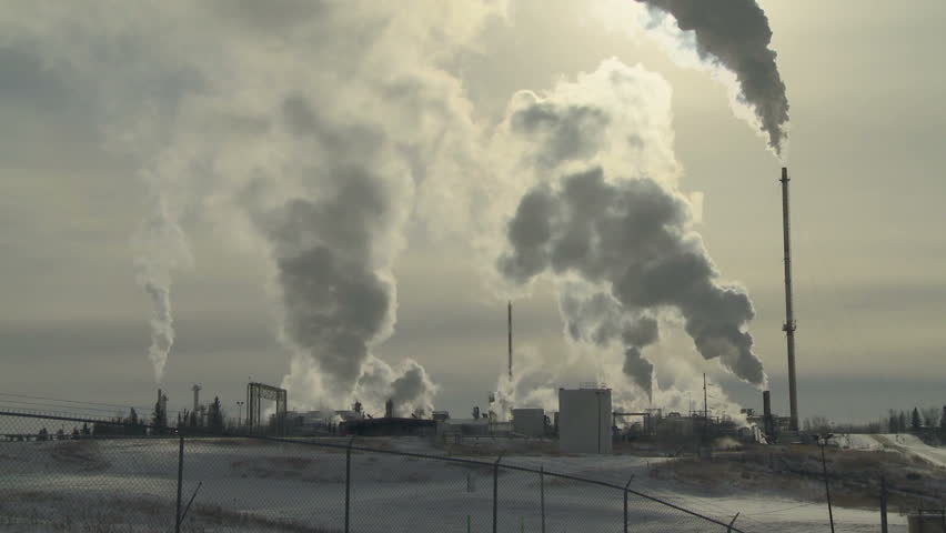 Gas plant in winter with smokestack emissions