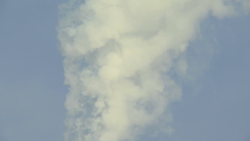 Smoke billowing from industrial smokestack