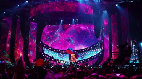 MOSCOW - NOV 28, 2015: Many spectators enjoy performance and video art during Disco 80 concert show by Autoradio in Olimpiyskiy sports complex