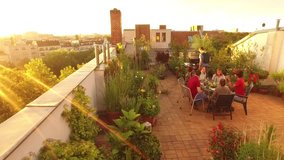a group of young people enjoying barbecue at late afternoon on a sunny roof garden 14 - Powered by Shutterstock - Get 15% off with code: PIKWIZARD15