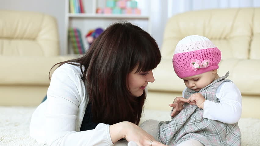 Family lying on the floor at home