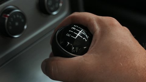Manual stick shift gearing up. 1 to 3 to 5. Shifting up. Close-up.