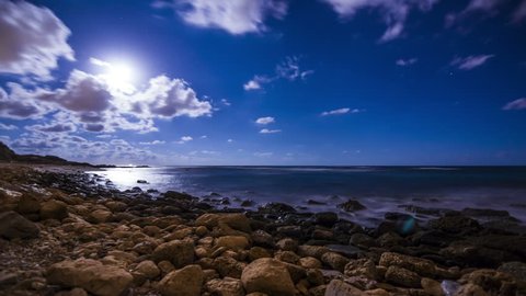 4k Time Lapse of Moonset and Stars over the mediterranean Sea. caesarea national park israel.