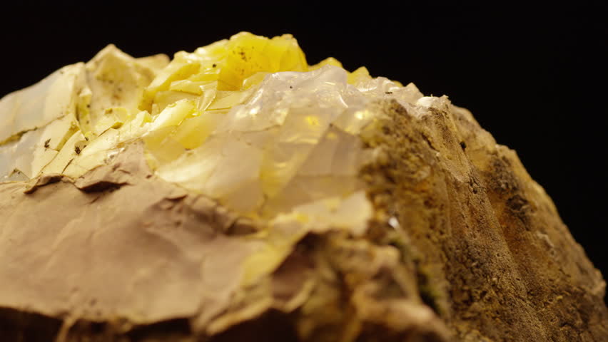 Rotating Fractured Quartz Stone with Yellow and White Crystal Formations, Macro