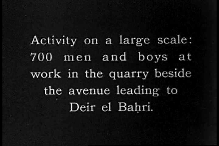 A wide shot of Egyptian men and boys excavating the archeological site at Deir el Bahri in the 1920s, in Egypt. (1920s)