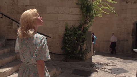 IZRAEL, JERUSALEM - 7 JUNE 2016: Woman tourist walking on the streets of Jerusalem in Israel