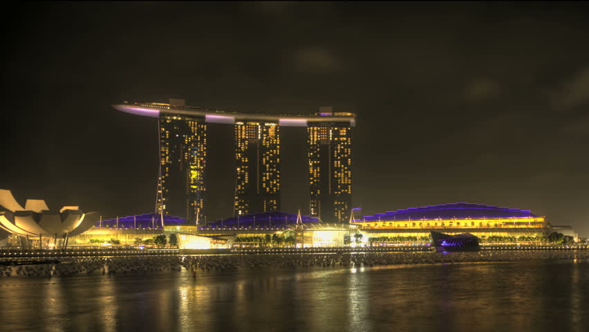 Timelapse Singapore Marina Bay at night with a view of the Opera and Skyscrapers