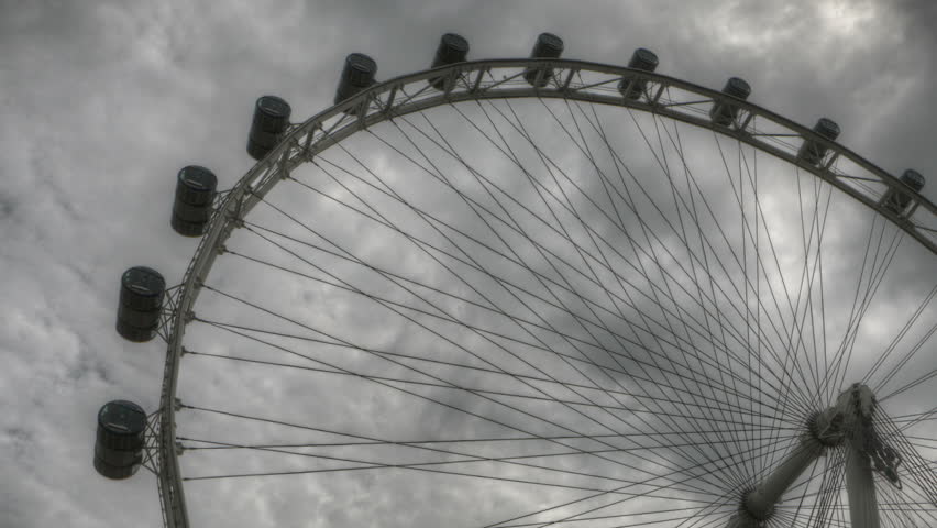 Timelapse Singapore Flyer with dark clouds in black and white