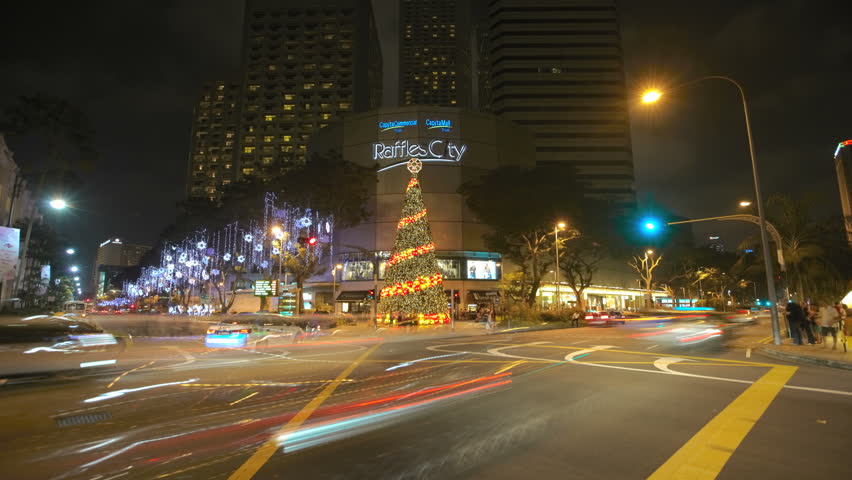 SINGAPORE - DEC 26 (Timelapse): Timelapse of street crossing near Raffles City