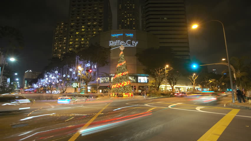 SINGAPORE - DEC 26 (TIMELAPSE): Timelapse of street crossing near Raffles City