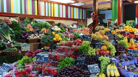 London, England â?? August 13, 2016 : A view of fresh fruit display at a stall at Borough Market in London.