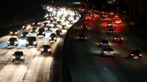 Zoom Out - Fast Traffic on the 101 Freeway in Los Angeles - Night
