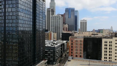 Pan Up of Downtown Los Angeles Office Building / Skyline Daytime - Circa August 2016
