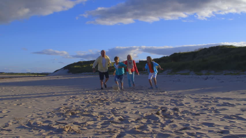 Grandparents Playing Soccer With Grandchildren On Beach Royalty-Free Stock Footage #18909050