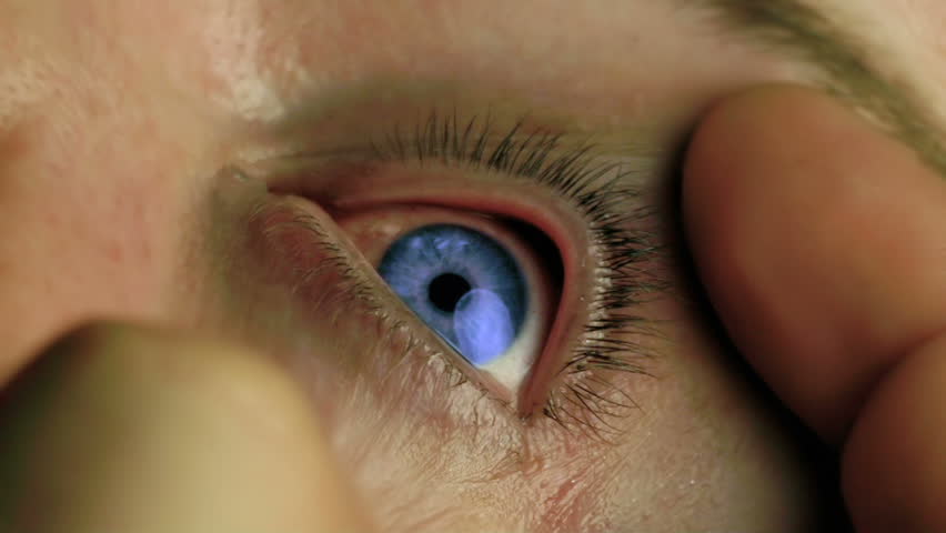 Eye Drop Falling Into Blue Eye Super Slow Motion