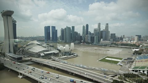 Timelapse Singapore aerial view of the marina bay going down