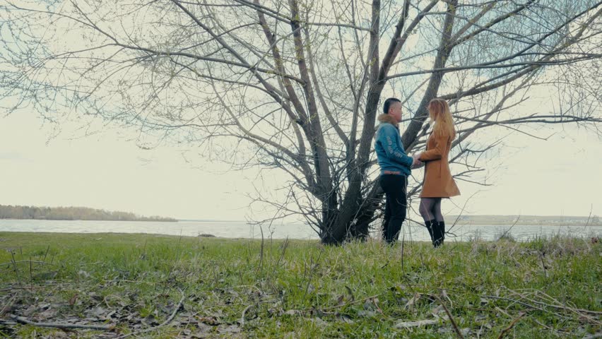 Couple Talking Under the Tree