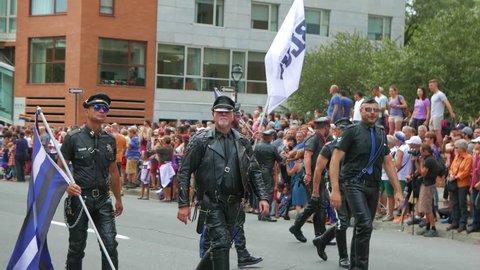 MONTREAL, CANADA - August 2016 : Men dressed in leather. Filmed During the 2016 annual LGBT gay pride parade festival in Montreal, Canada.