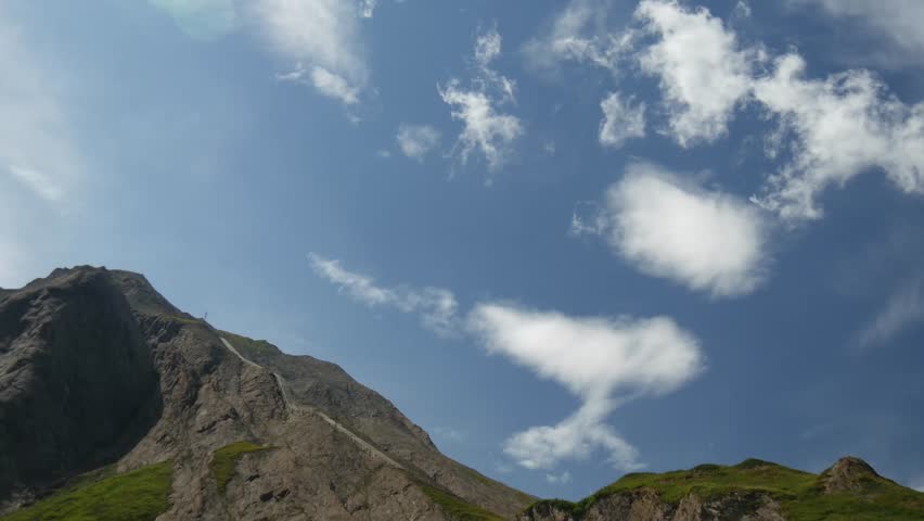 time lapse:  white clouds in the mountains.
