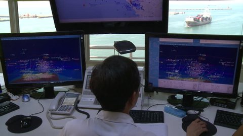 Kaohsiung, Taiwan-10 September, 2015: A operator is working in vessel traffic service center (Control Tower) in Port of Kaohsiung, the largest harbor in Taiwan.