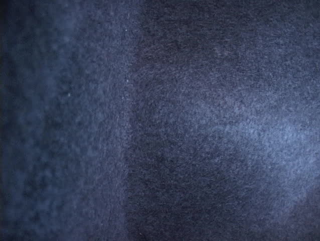 Rescue and relief workers wear respirators in a neighborhood after Hurricane Katrina.