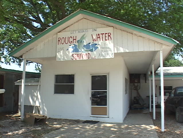 Oyster shuckers work in a factory along the East Coast of the United States.